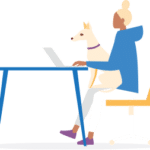 Person sitting at a desk typing at a laptop with a dog on their lap